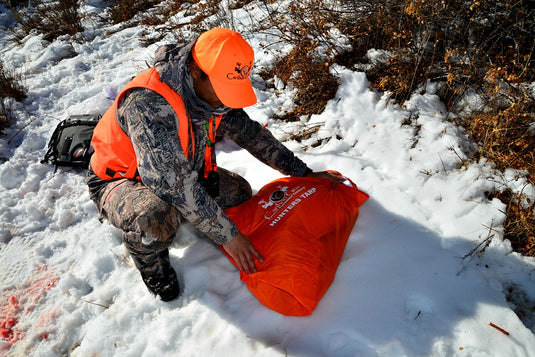 The Hunters Tarp Covering Caribou Gear Game Bags
