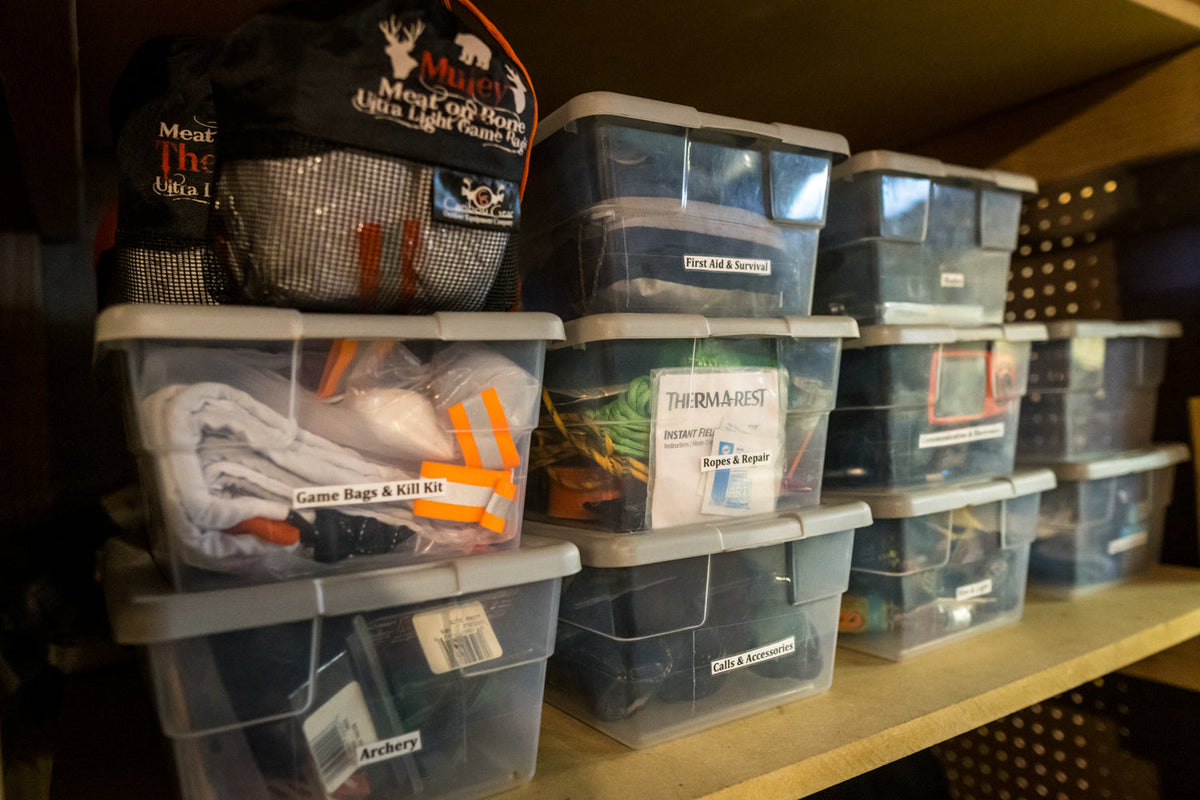 Clean Caribou Gear game bags staged and labeled for elk and mule deer hunts before hunting season