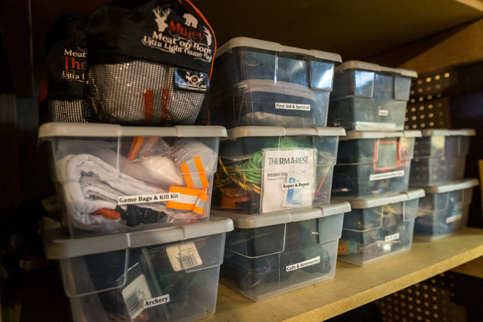 Clean Caribou Gear game bags staged and labeled for elk and mule deer hunts before hunting season