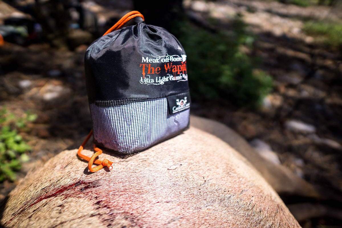 Caribou Gear game bags staged by species for elk, deer, moose, and big game meat care