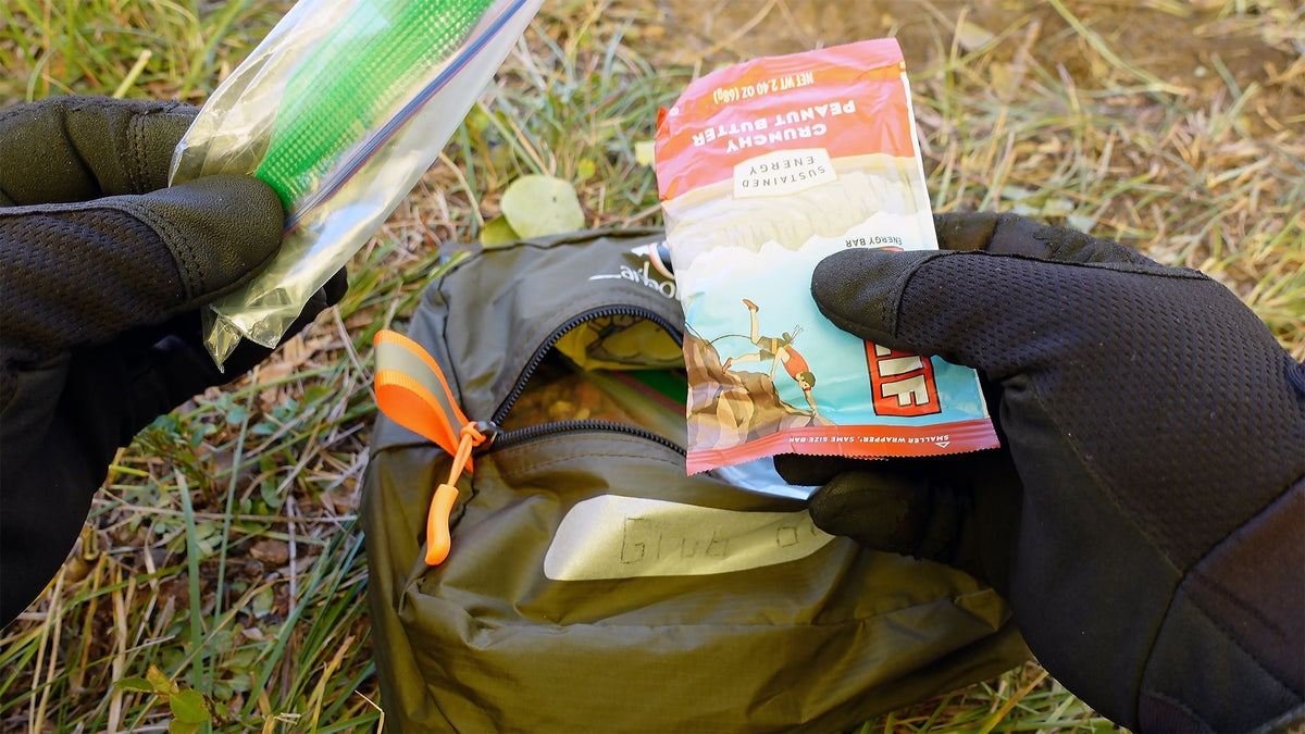 Modular hunting pack organization system with Ditty Bags, Hunter’s Tarp staging platform, and a kill kit laid out for fast access