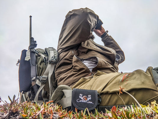 Spring scouting notes system with map pins, notebook, and field gear organized for documenting hunting intel