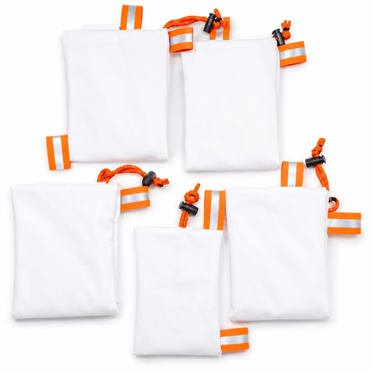 Caribou Gear Wapiti five-bag elk game bag system with breathable white synthetic bags, orange reflective tabs, and drawcord closures
